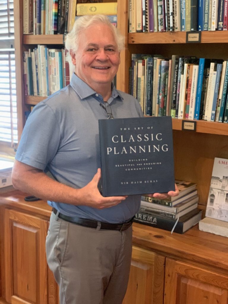 ICAA - LA Chapter President, Kevin Harris, holding his copy of Classic Planning by Dr. Nir Buras